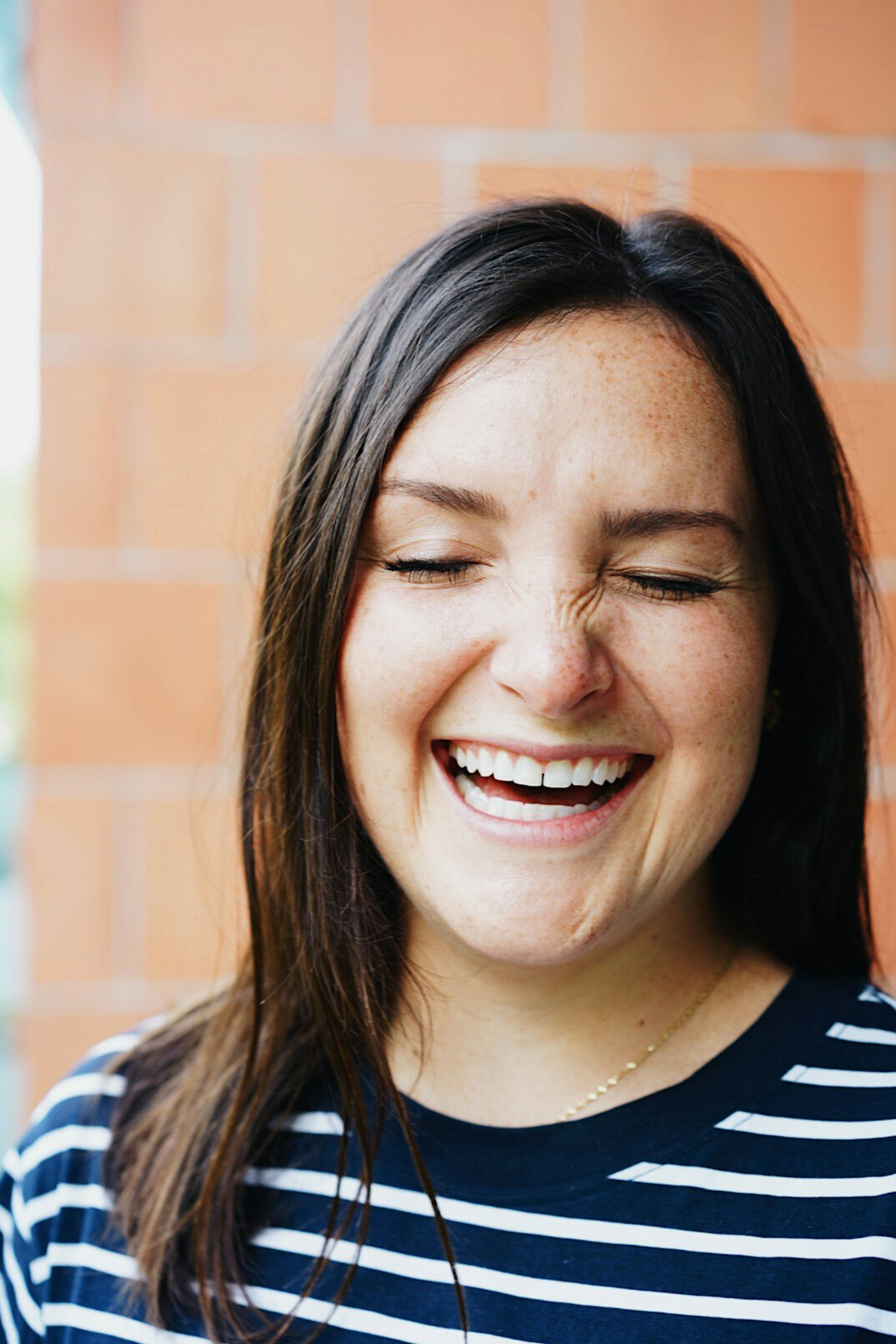 smiling woman in sunlight