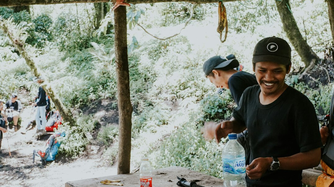 Group of friends talking and smiling around a table