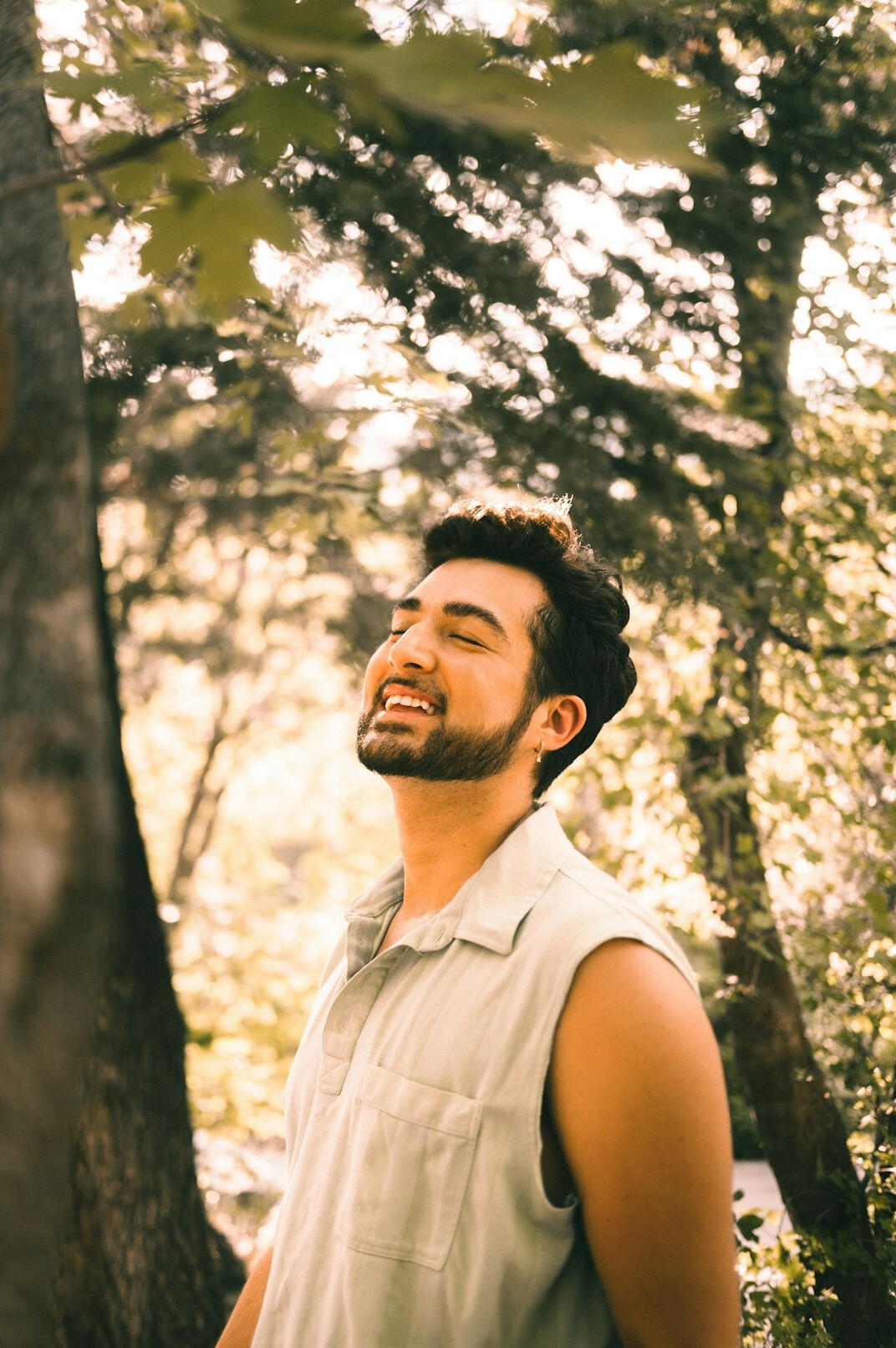 person meditating in forest